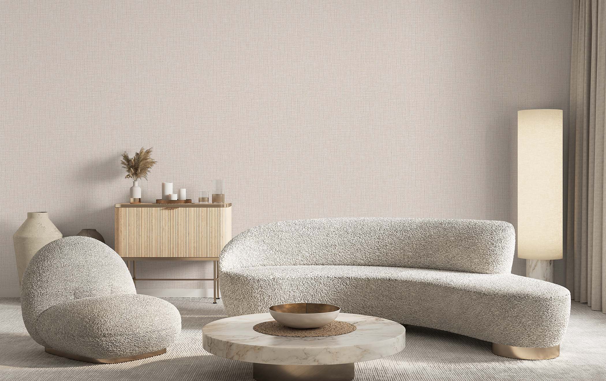A modern living room featuring a curved boucle sofa, a matching armchair, a round marble-top coffee table, and a light wood sideboard against a textured beige wall.