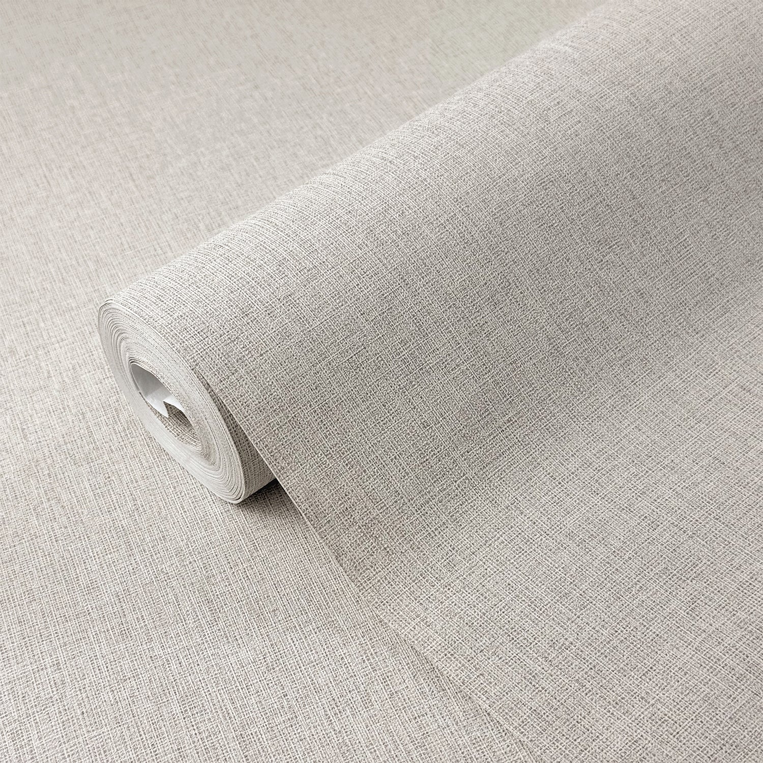 A roll of light gray textured wallpaper or fabric with a linen-like woven pattern, shown partially unrolled on a matching neutral background.